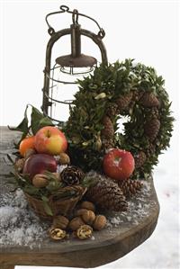 Rustic Christmas decorations on wooden table out of doors