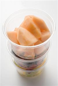 Fresh fruit in three plastic tubs