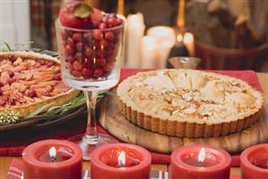 Two apple tarts on Christmassy table