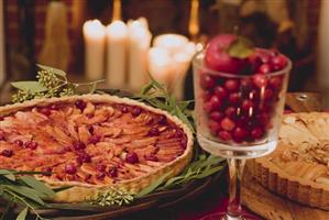 Two apple tarts on Christmassy table