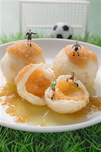 Apricot dumplings with football figures