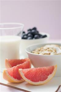 Muesli ingredients: cereal, yoghurt, blueberries, grapefruit