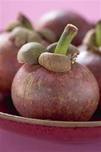 Mangosteens in bowl (detail)