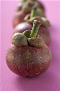 Mangosteens in a row