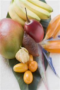 Assorted exotic fruits on banana leaf