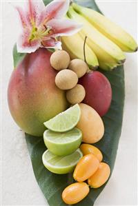 Assorted exotic fruits on banana leaf