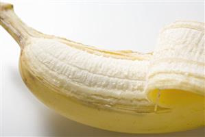 Banana, partly peeled (close-up)