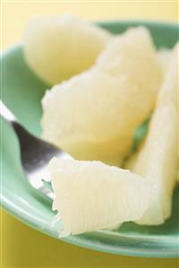 Grapefruit segments on plate and fork