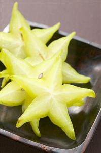 Carambola slices in wooden dish