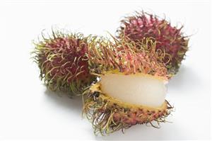 Several rambutans, whole and cut open