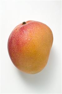 A mango with drops of water