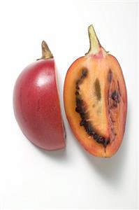 Two wedges of tamarillo (overhead view)