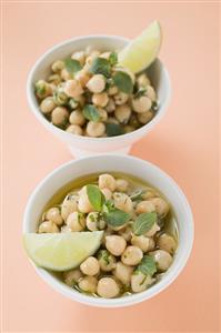 Chick-peas with lime wedges and herbs