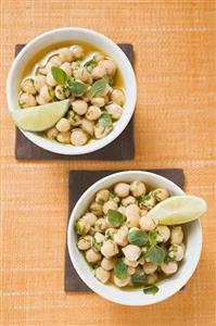 Chick-peas with lime wedges and herbs