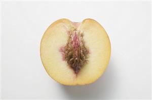 Half a peach with stone (overhead view)