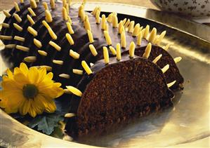 Rehrücken cake (chocolate roll) with slivered almonds