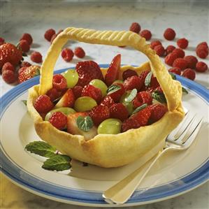 Baked fruit basket with fresh berries and grapes