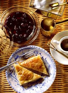 Morello cherries in syrup and a halved milk pie