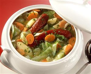 Abundant Vegetable Soup with whole Sausages in Tureen