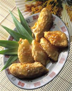 Baked banana and pineapple pieces on plate