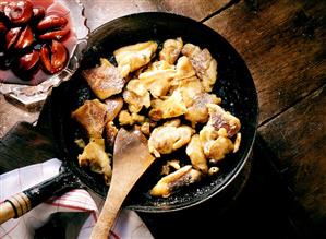 Raisin pancakes with damson compote in the pan (1)