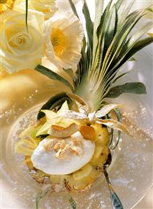 Pineapple half filled with coconut mousse and fruit salad (1)