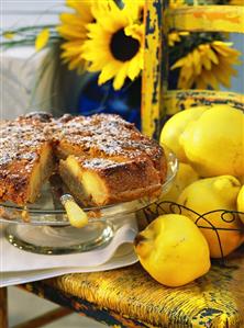 A quince tart, a piece cut, on cake plate