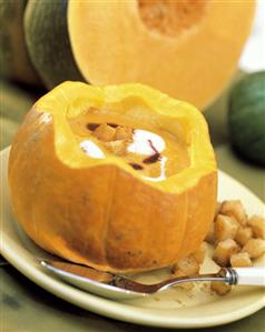 Cream of Pumpkin Soup Served in a Carved Out Pumpkin