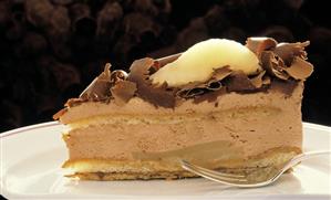 Chocolate cream gateau with pear and grated chocolate