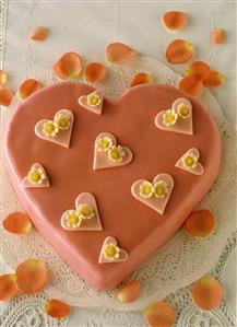 Heart-shaped punch cake with pink icing