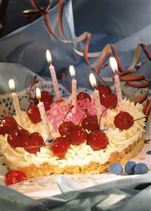 Birthday cake: cream and nut with candied cherries