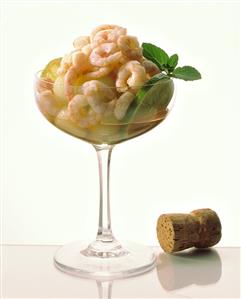 Shrimp cocktail with melon balls, limes