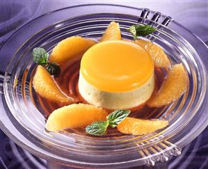 Pistachio-Orange Flan with Raspberry Sauce and Orange Slices