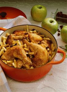 Spicy apple chicken with raisins & Calvados in stewpot