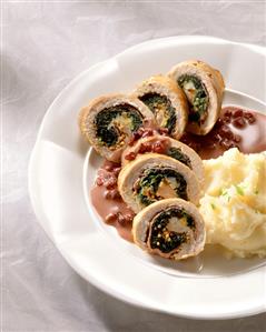 Chicken breast roulades stuffed with spinach, pomegranate sauce