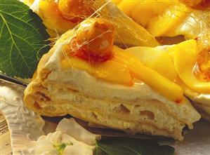 A few pieces of peach cream gateau decorated with caramel