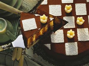 Chess board cake with marzipan crowns, a piece cut (1)