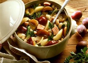 Bean stew with plums, smoked pork rib and potatoes