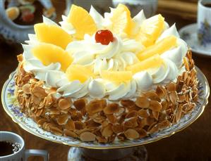 Pineapple cream gateau with almond border