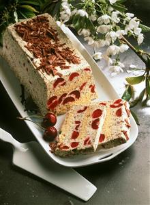 Loaf-shaped ice cream gateau with poppy seeds & cherries