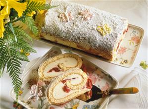 Sponge roll with advocaat quark filling & morello cherries