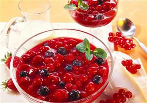 Berry cream in a glass bowl and a dessert glass