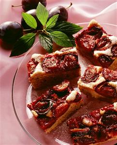 A few pieces of plum cake on glass plate