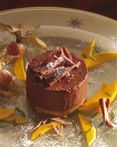 Chocolate tart with mango wedges & Cape gooseberries