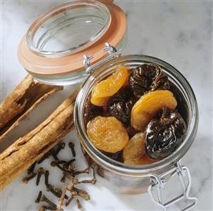 Bottled prunes and dried apricots in jar