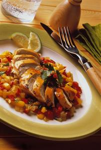 Fried chicken breast fillet on mango & pepper salsa