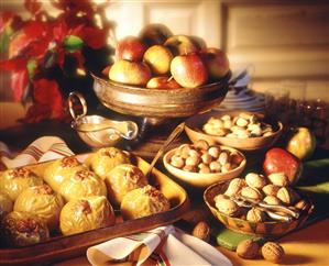 Marzipan baked apples against winter fruit & nut arrangement