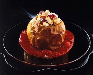 Baked apple with almond & coconut filling & raspberry sauce