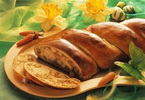 Apple plait on wooden tray with spring decoration