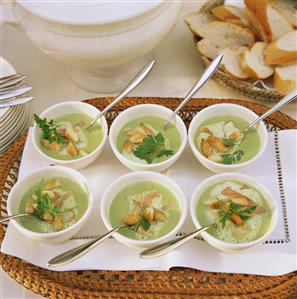 Pea soup with salmon strips and croutons in bowl (3)